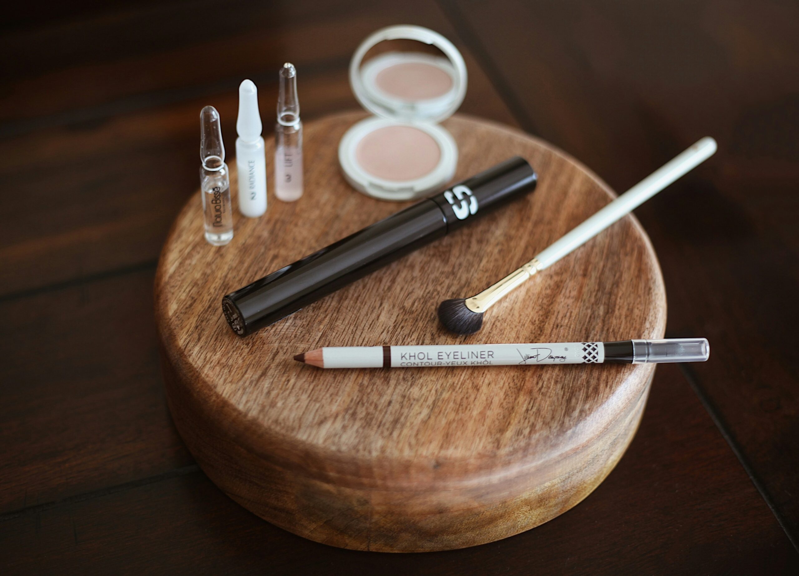 Several different styles of pet grooming bristle brushes laid out on a table